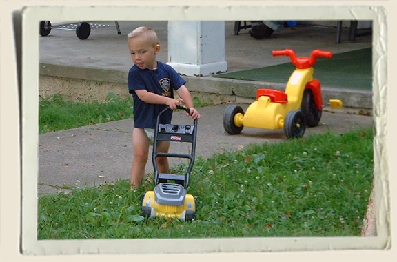 Kyle Piper mowing the lawn.  Aunt Heather Piper 