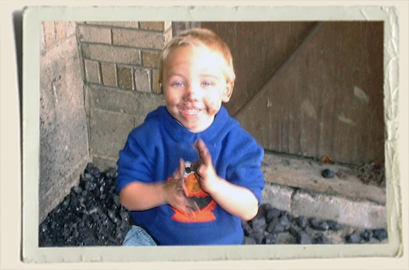 Kyle playing in coal - Aunt Heather Piper 