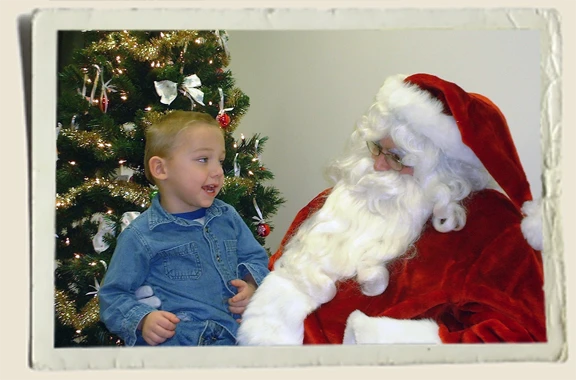 Kyle-Piper-with-Santa Kyle Piper sitting on Santa