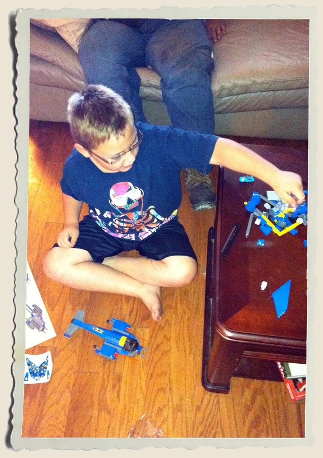 Kyle Piper playing with his legos 