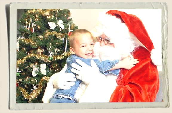 Kyle hugging Santa Clause Aunt Heather Piper 