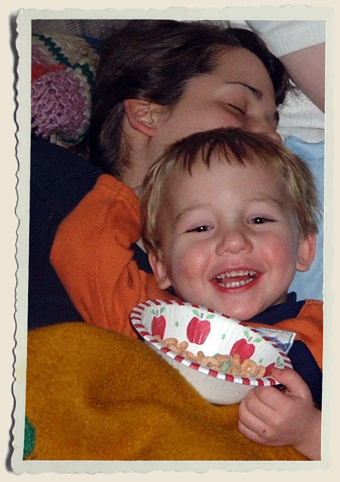Kyle laying on a sleeping Aunt Heather Piper 