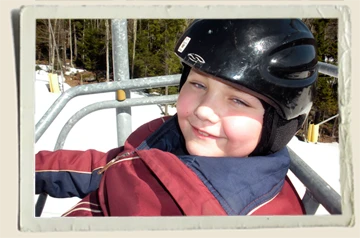Kyle sitting on ski lift in Snowshoe WV Aunt Heather Piper 