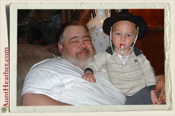 Kyle-with-pappy-in-cowboy-hat-11-18-03