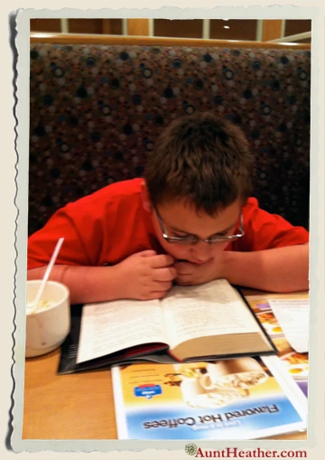 Kyle-Reading-Hunger-Games-at-IHOP-Aunt-Heather-Piper