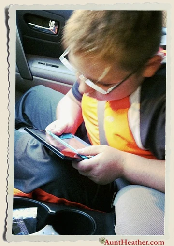 Kyle-playing-video-games-in-car-Aunt-Heather-Piper-2012