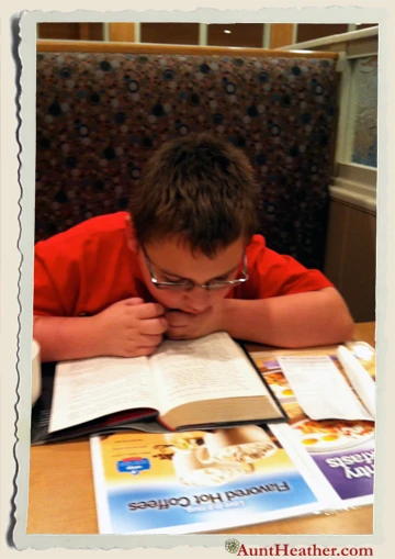 Kyle-reading-Hunger-Games-at-IHOP-2012-Aunt-Heather-Piper