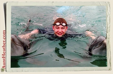 Kyle-with-dolphins-on-cruise-6-2015-Aunt-Heather-Piper